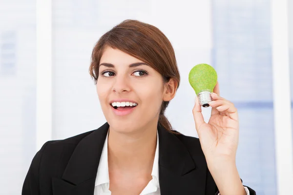 Businesswoman Holding Light Bulb