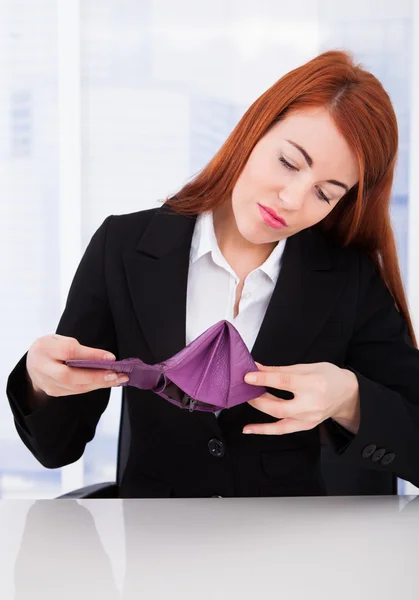 Businesswoman Looking At Empty Wallet