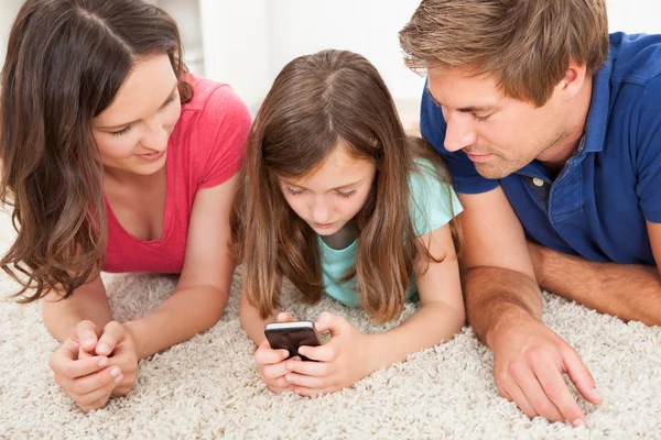 Parents and  Daughter Using Smart Phone