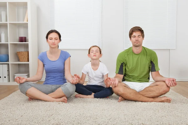 Family Practicing Yoga