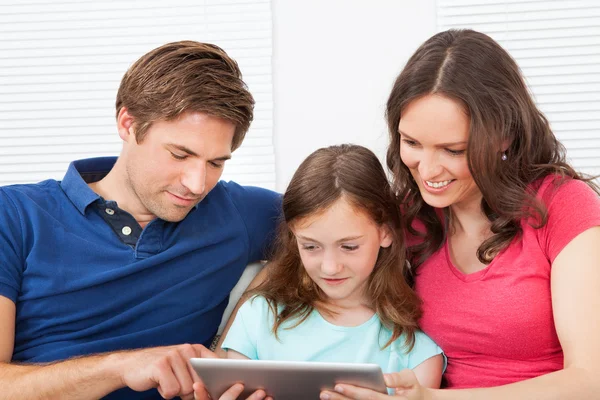 Family Using Digital Tablet
