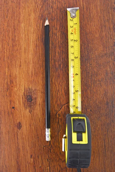 Laminate and tape measure and pencil