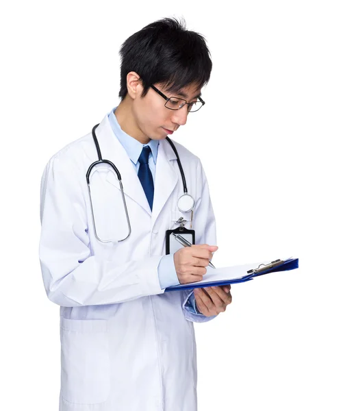 Doctor write on clipboard