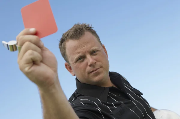 Soccer Referee Assigning Red Card
