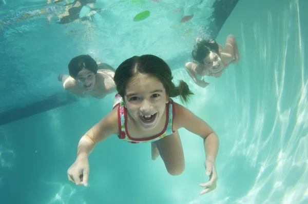 Portrait of a preadolescent children swimming underwater