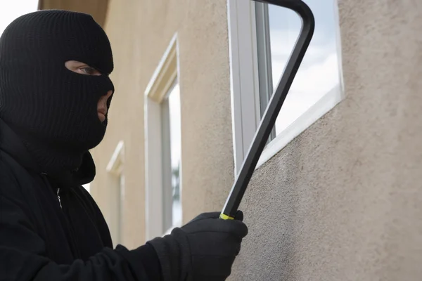 Burglar Breaking Into House
