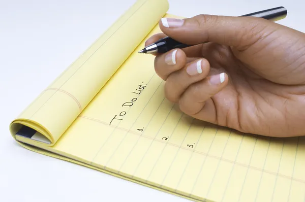 Hand Writing List Of Tasks To Do On Notepad