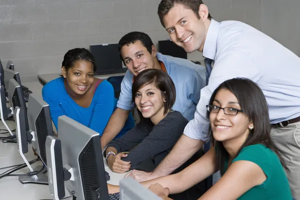 Teacher And Students In Computer Lab