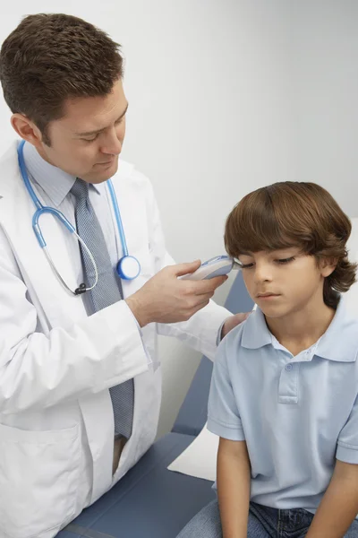 Doctor Taking Boy\'s Temperature