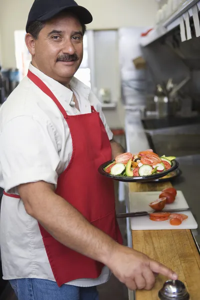 Hispanic Latin man serve food
