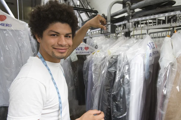 Young Man Working In Dry Cleaning