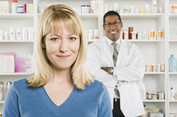 Pretty Woman And Pharmacist At Pharmacy