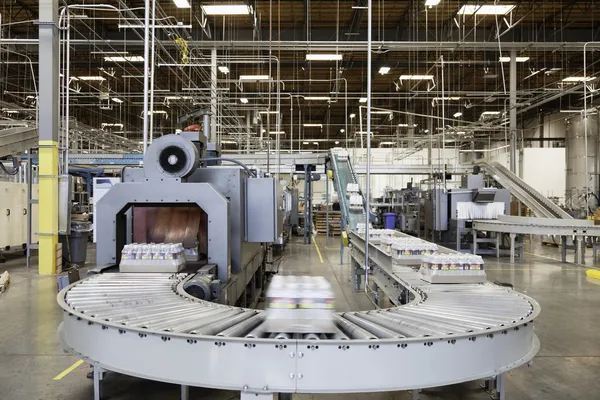 Packed bottle moving on conveyor belt