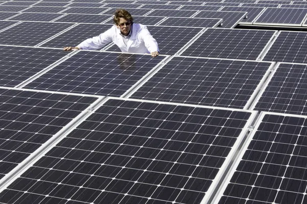 Man surveying solar panels