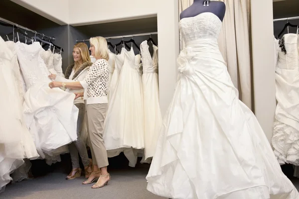 Mother and daughter in bridal boutique