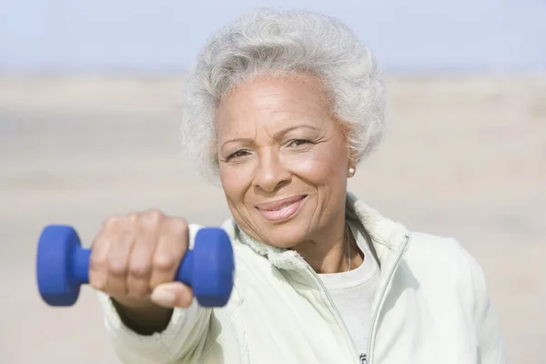 Senior Woman Exercising With Dumbbells