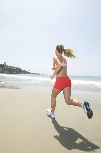 Woman Jogging At Beach — Stock Photo #21901413