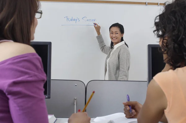 Teacher And Students In Classroom