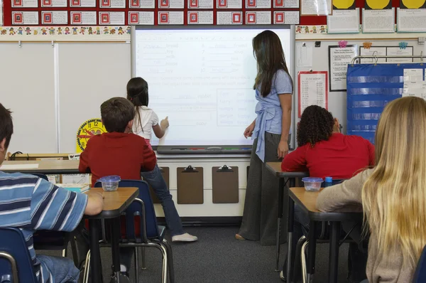 Teacher And Students In Classroom