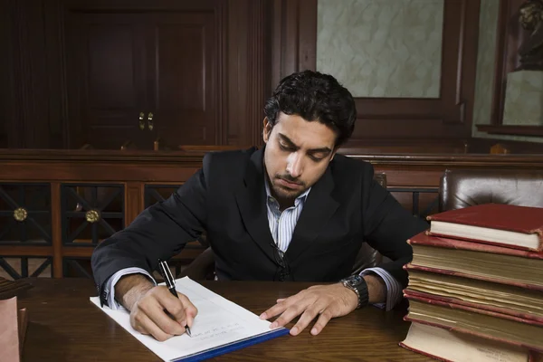 Male Advocate Preparing Notes