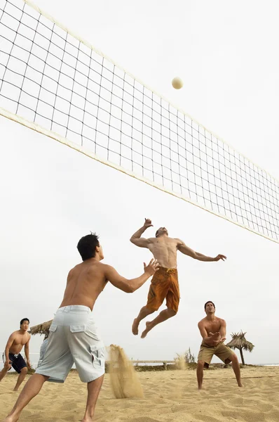 Man in Mid-air Going for Volleyball