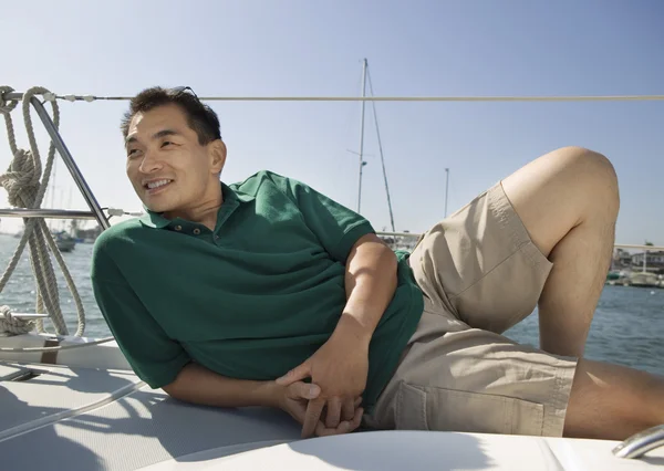 Man relaxing on sailboat