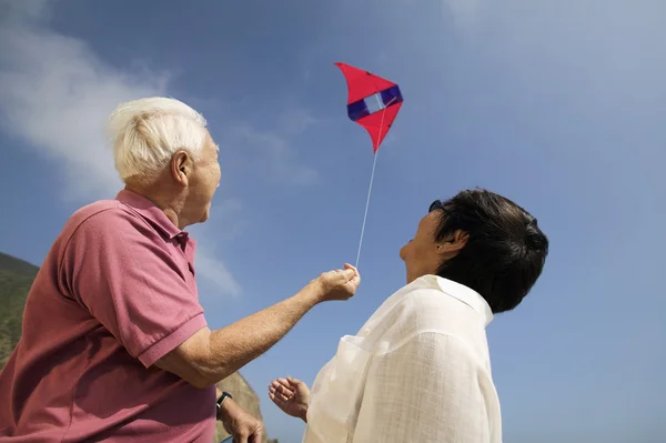 Couple flying kite