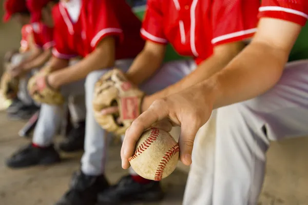 Baseball team-mates in dugout