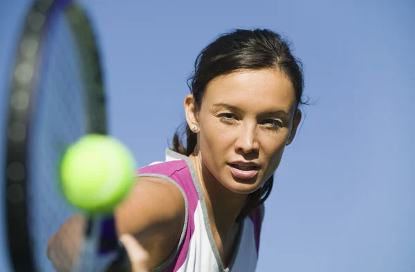 Female Tennis Player Hitting Ball — Stock Photo #33808407