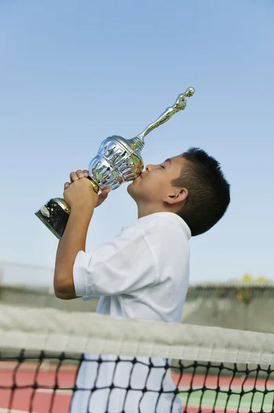 Tennis Player Kissing Trophy