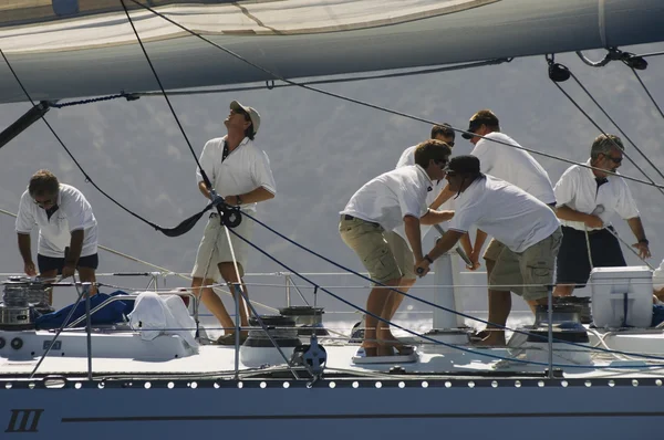 Crew working on yacht