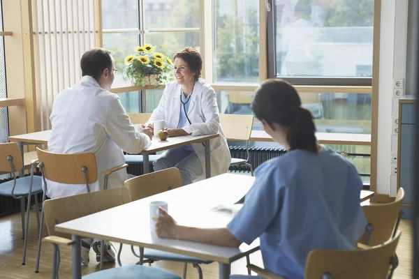 Doctors on Work Break in Cafeteria