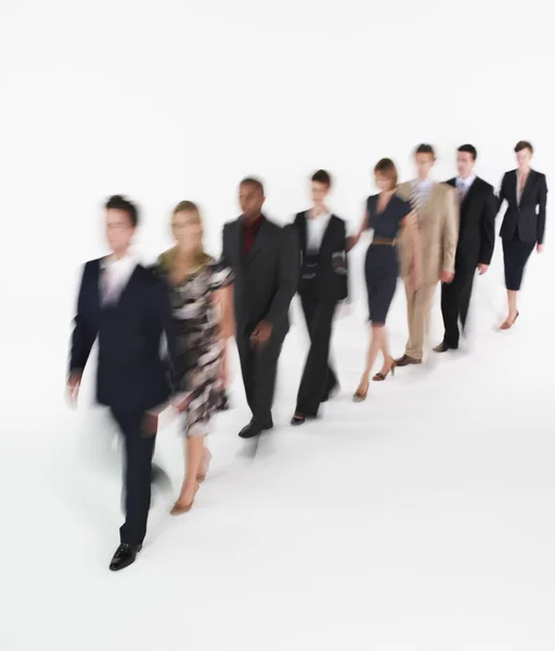 Line of businesspeople walking blurred