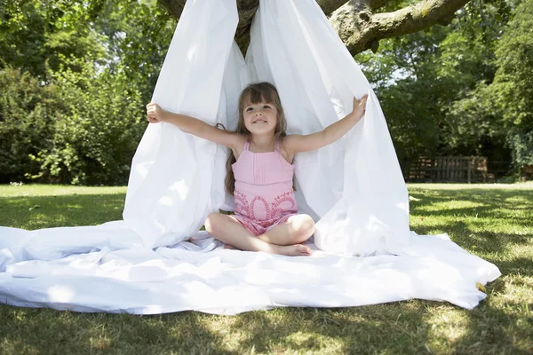 Girl in backyard in tent