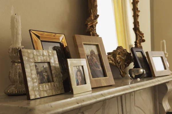 Fireplace Mantel With Framed Pictures