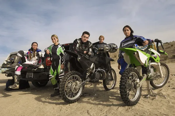 Motocross racers with bikes