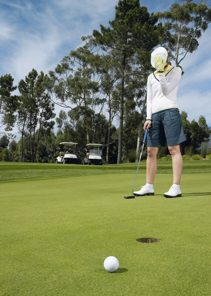 Disappointed golfer on putting green