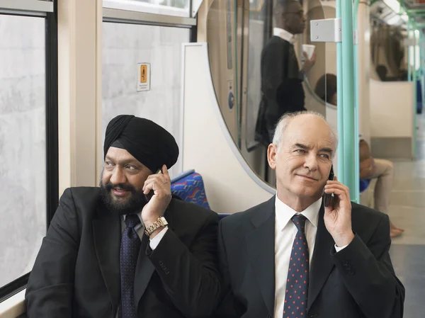 Businessmen Using Cell Phones