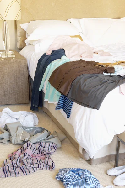 Clothes on Floor and Bed