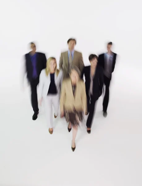 Businesspeople walking blurred effect