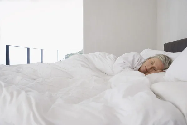 Woman Asleep in Bed