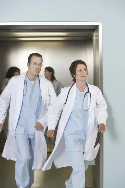 Doctors running out of elevator