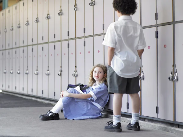 Elementary school students near school lockers