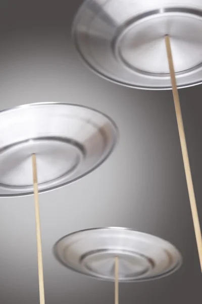 Plates Spinning on Sticks