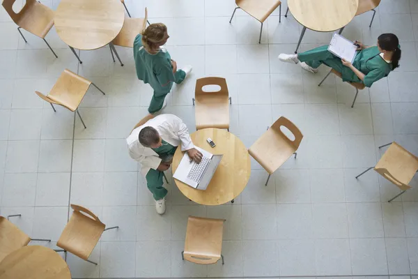 Physicians sitting in cafeteria