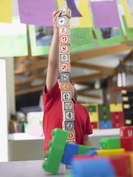 Student with alphabet blocks