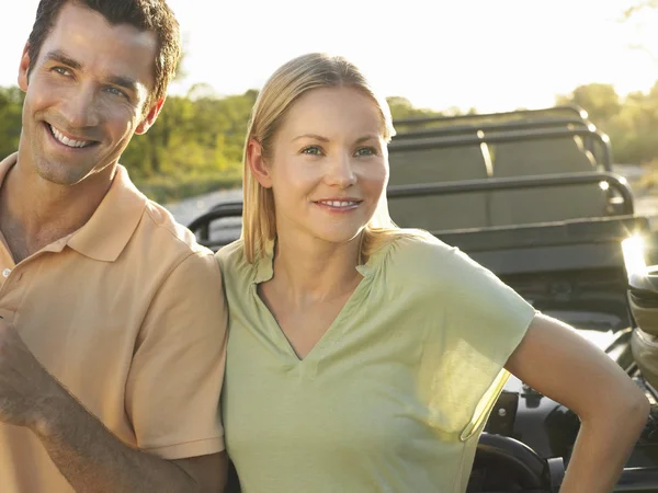 Smiling Couple near jeep