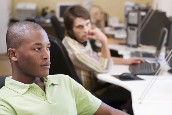 Businesspeople working at desk