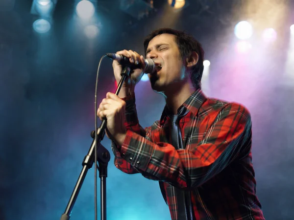 Man Singing on stage