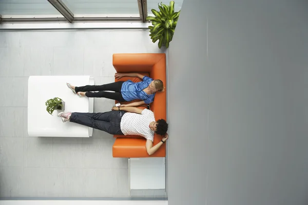 Workers Relaxing in Lobby